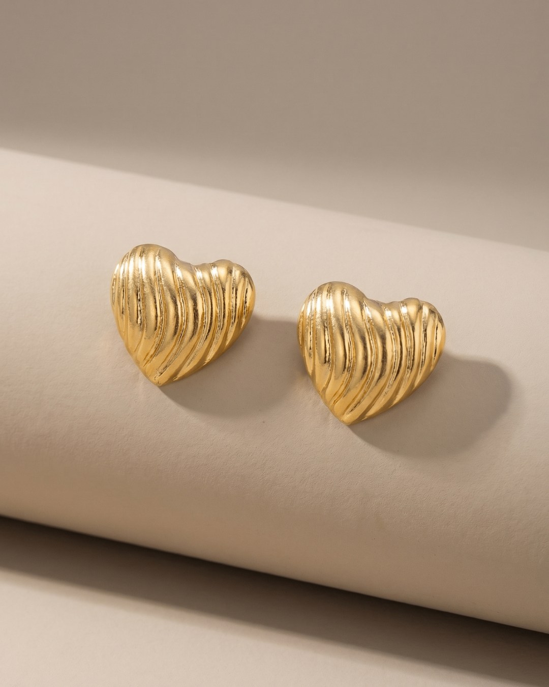 Radiant Ribbed Heart Gold Finish Earrings