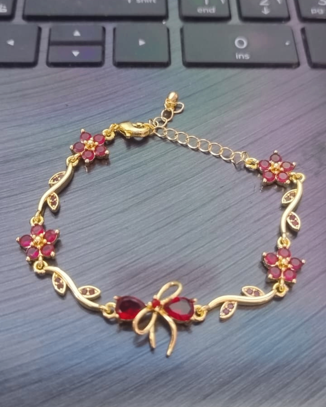 Ruby Bloom Gold Bracelet with Floral & Bow Design | Premium Quality | Cubic Zirconia