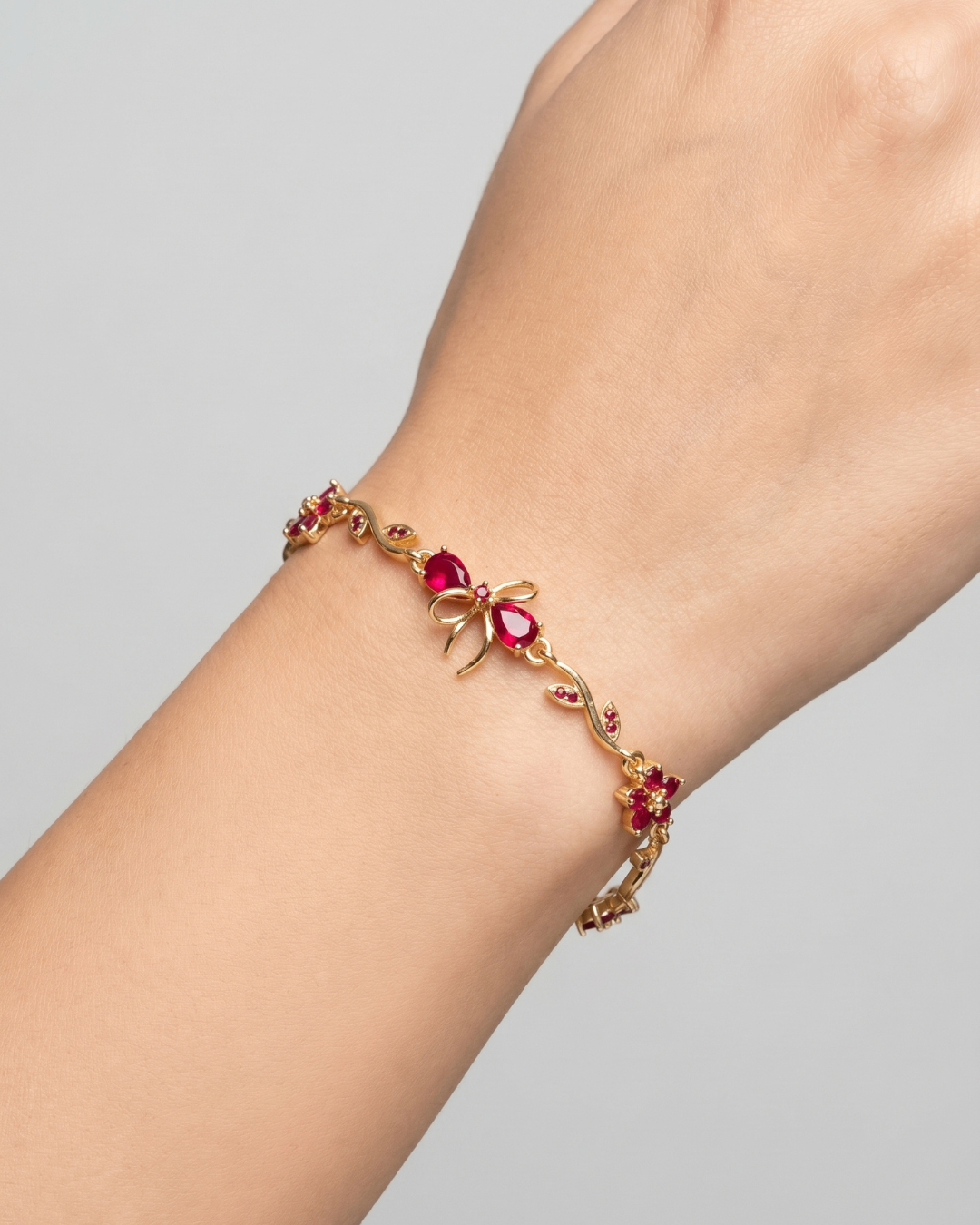 Ruby Bloom Gold Bracelet with Floral & Bow Design | Premium Quality | Cubic Zirconia