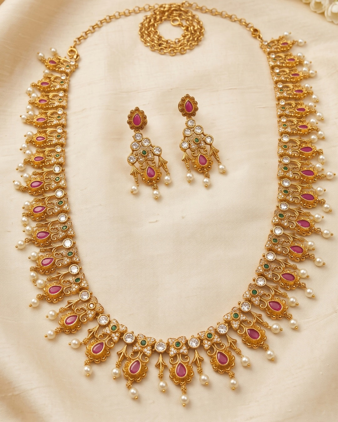 Regal Ruby Pearl Long Haram Set with American Diamond & Emerald Accents – Premium Traditional Bridal Necklace