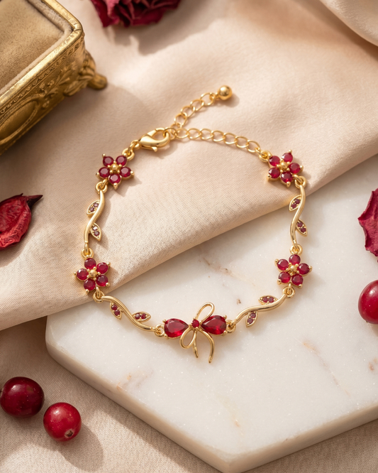 Ruby Bloom Gold Bracelet with Floral & Bow Design | Premium Quality | Cubic Zirconia